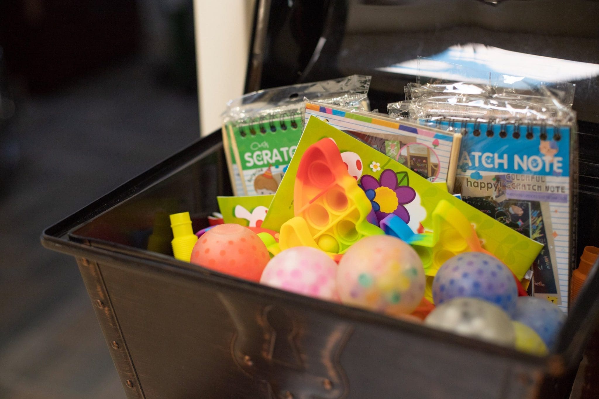 Treasure box filled with toys and sensory-friendly rewards for patients after their dental visit, creating a positive and comforting experience.